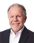 portrait of jerry colella in a black suit and white shirt