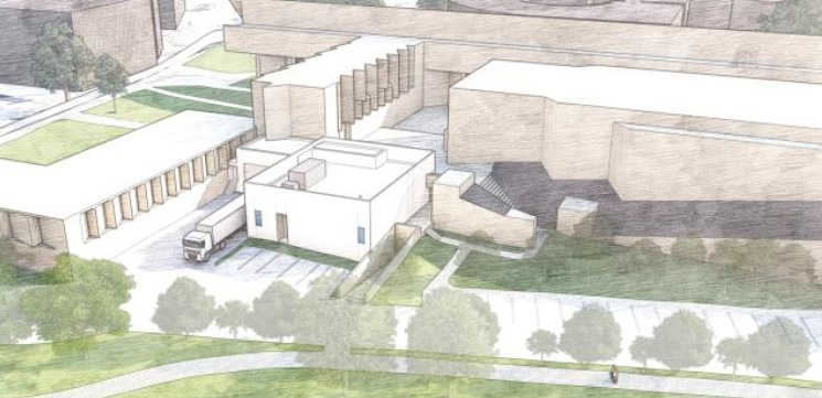 Drawing of multi sections and heights building with loading dock and truck parked at the loading dock