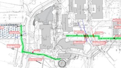 drawing of map of campus showing several buildings and path marked in green showing the thermal wells